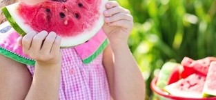The girl who is eating watermelon