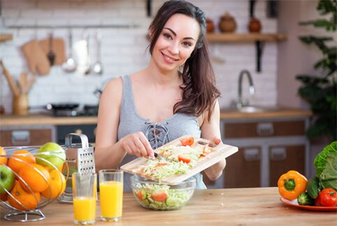 The girl who is preparing the food for proper nutrition